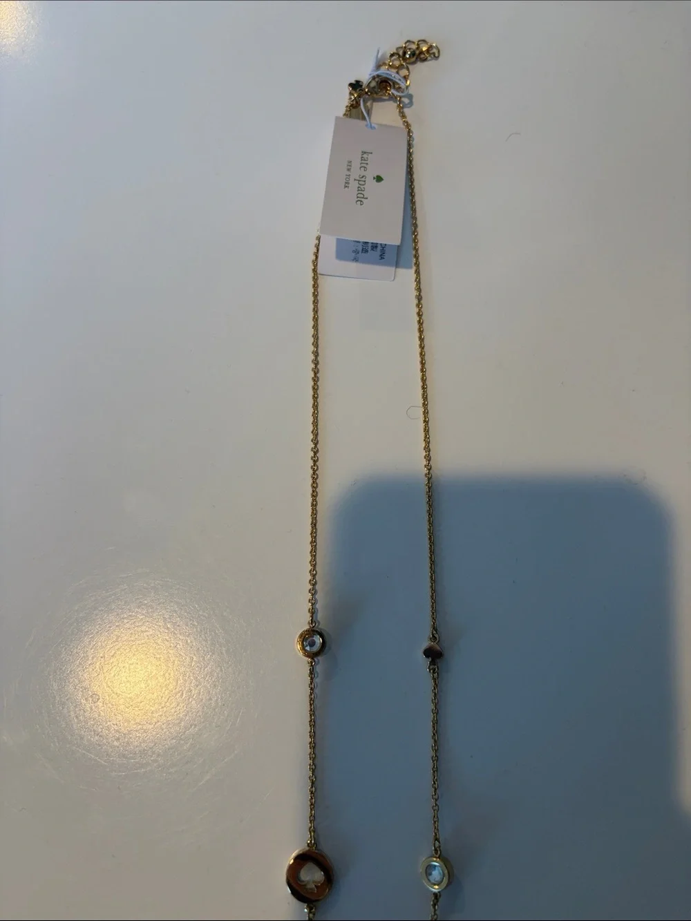 NWT Kate Spade long goldtone and black necklace